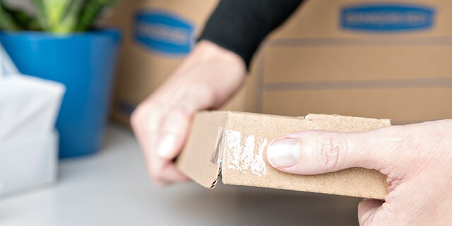 Patch Storage Box Corners with Scotch® Super-Hold Tape
